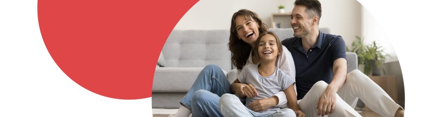 Family with mum, dad and daughter in living room